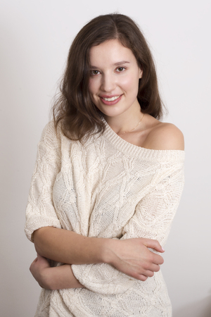 portrait of a young woman wearing a jumperの写真素材