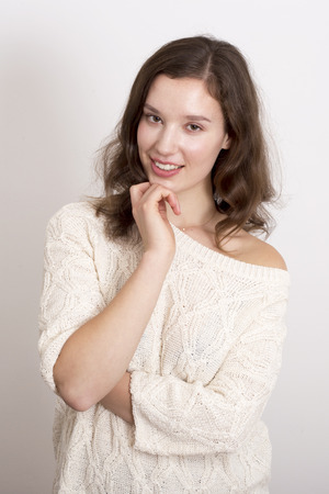 cute young woman wearing a jumperの写真素材