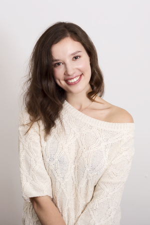 young woman posing wearing a jumperの写真素材