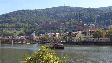 Heidelberg Castle in the foreground of the River Neckar and the Old Bridgeの写真素材