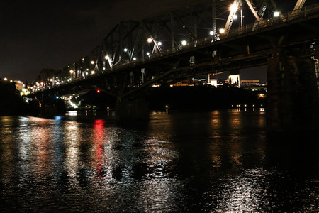 Alexandra Bridge between Ottawa, Ontario and Gatineau, Quebec reflecting over the Ottawa River at night.の写真素材