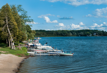 Pushlinch Lake, Freelton, Ontario, Canada, August 23, 2017, Lake-side with boats docked, 2017.のeditorial素材