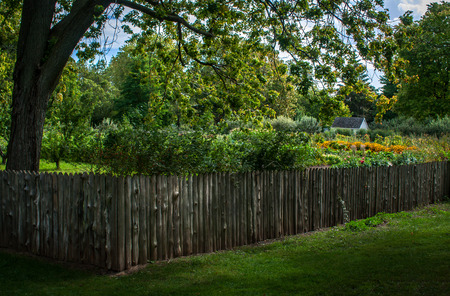 Dundurn Park, Hamilton, Ontario, Canada. September 8, 2017. Log fence and green grass. 2017のeditorial素材