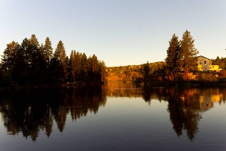 Sunrise on a beautiful sunny morning on a lakeの写真素材