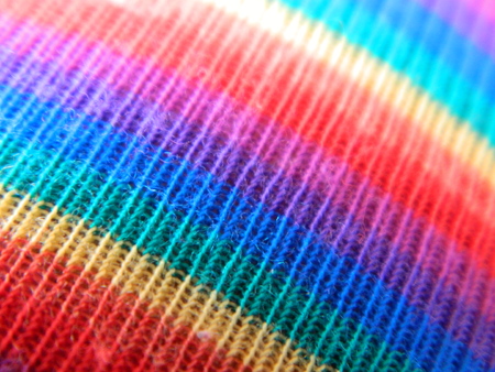 Close up of a rainbow patter on some textilesの写真素材