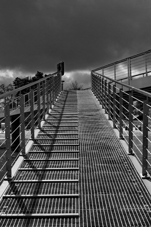 A grid grating path leads upwardsの写真素材
