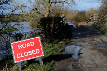 Road closed due to flooding of the River Great Ouse in Buckinghamshireの写真素材