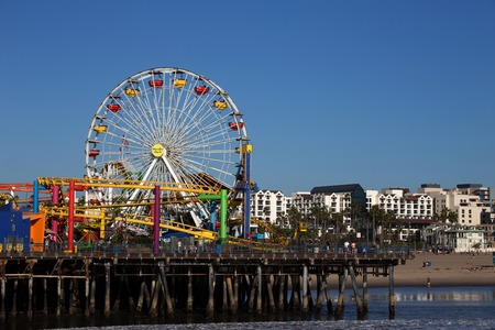 Ferris Wheel and roller coaster in Pacific Park, Santa Monica Pier, Santa Monica, Californiaのeditorial素材