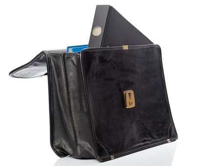 Black file folder looking out of an open brieface (with a second folder inside).
