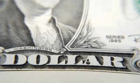 Close-Up shot of a dollar bill, focus on the text "Dollar".

Macro shot with very shallow depth of field.の写真素材