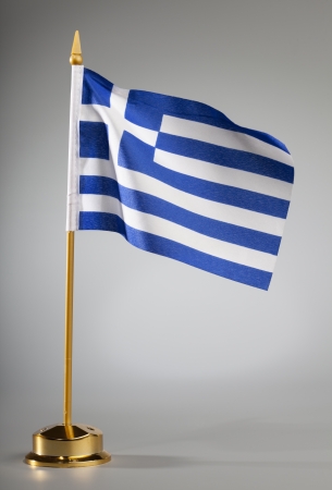 Greek flag on a grey background  with center spot light on the background  の写真素材