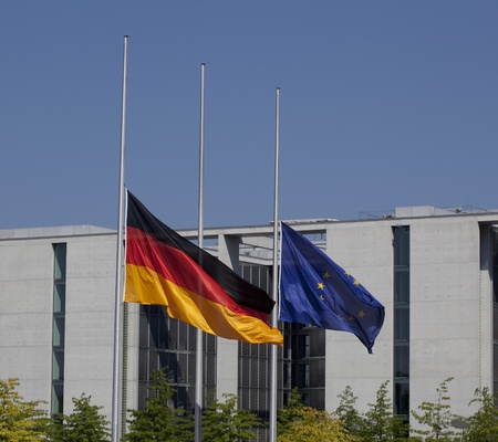 German and European flags on half-mast in front of the German parliament buildings in Berlin....