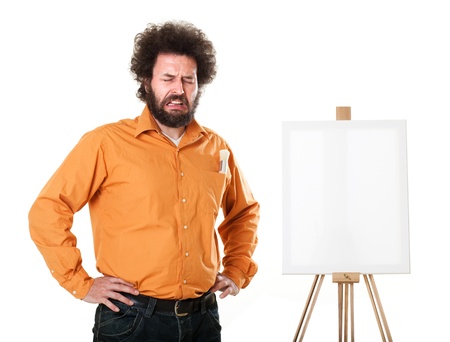 Guy in a bright, orange shirt, ready to paint, crying in front of his canvas.

Self portraits in studio, isolated on white..の写真素材