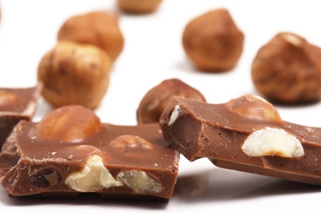 Pieces of chocolate with hazelnuts in the background.

Macro shot with shallow DOF, focus on the chocolate piecesの写真素材