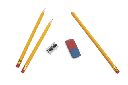 Three pencils with a sharpener and eraser rubber, isolated on white backgroundの写真素材