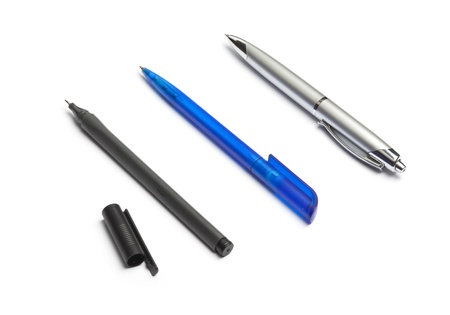 Three different pens in black, blue and silver, isolated on white background.