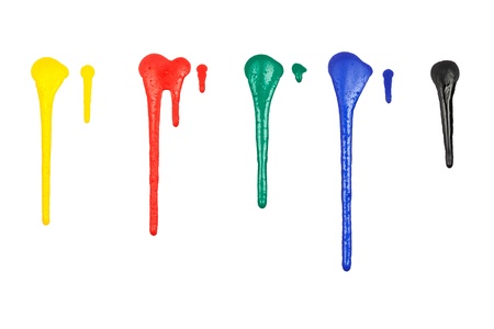 Multiple drops of paint in different colors, isolated on white background.