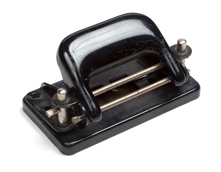 Black perforator in vintage/retro style, isolated on white background.の写真素材