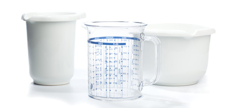 Two plastic baking bowls and a measuring jug or beaker  Isolated on white background の写真素材