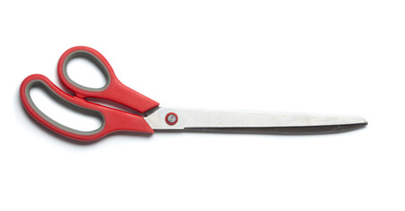 Extra large, oversized scissors with red grip  Studio shot, isolated on white background 
