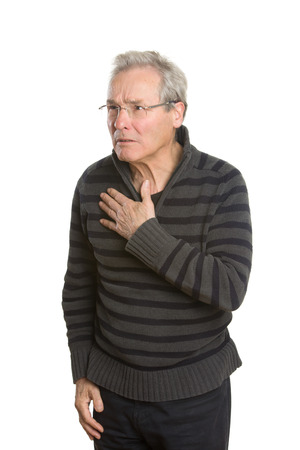 Portraits of a senior Caucasian man with glasses in casual clothing, arguing with an unseen person outside the picture frame. Isolated on white background.の写真素材