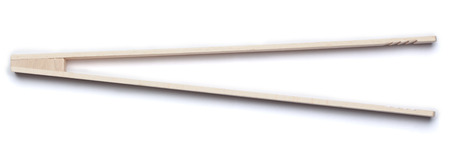 Wodden barbecue tongs. Part of a series of kitchen utensils. Isolated on white background.の写真素材