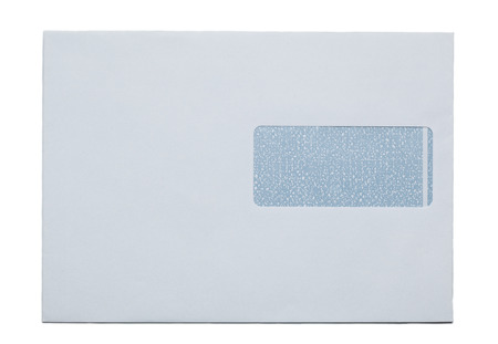 Traditional white snail mail envelope with address window. Studio shot, cutout.の写真素材
