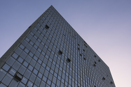 Office skyscraper built in 1960s in afternoon sun. Essen, Germany.