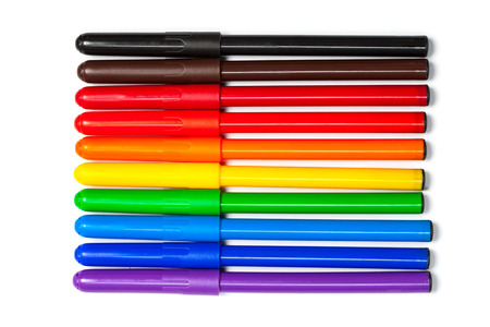Pens in colors like a rainbow, violett to red, brown and black. Cutout, isolated on white .