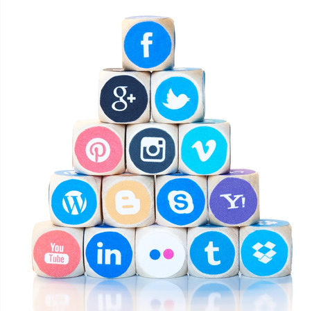 Stack of dices in pyramid form with different social media network icons, logos, from Facebook through Google Plus, Twitter and Instagram to LinkedIn. Modern internet marketing concept.のeditorial素材