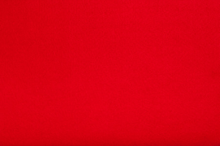 Macro shot of red felt tissue cloth, closeup texture background with details in structure.の写真素材