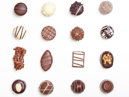 Variety of chocolate truffles, pralines, isolated on white background.の写真素材