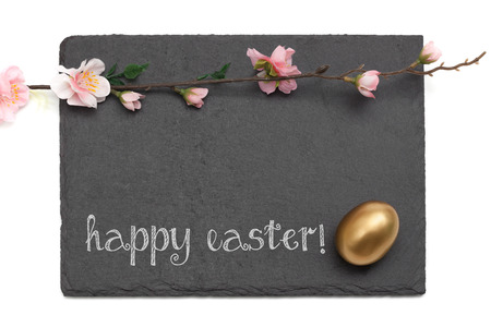 Easter Slate board with flowers and Golden Egg. Text reading, Happy Easter