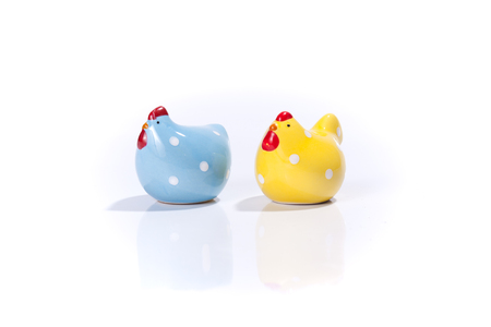 Salt and Pepper shakers in chicken form, isolated on white backgroundの写真素材
