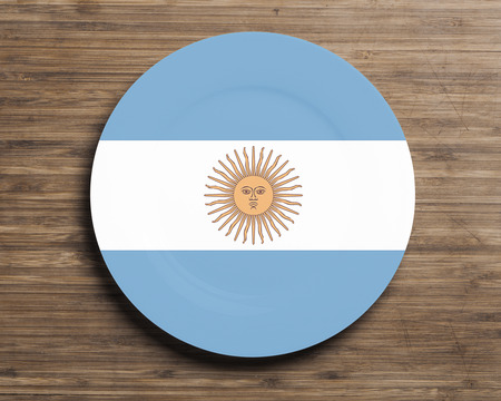 Plate on table with overlay flag of  Argentinaの写真素材