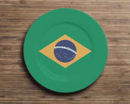 Plate on table with overlay flag of Brazilの写真素材