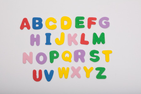colored, playful lettering spelling out the english alphabet. isolated on white, studioshoot