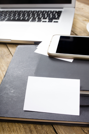 Desktop in office with laptop, tablet computer and phone.の写真素材