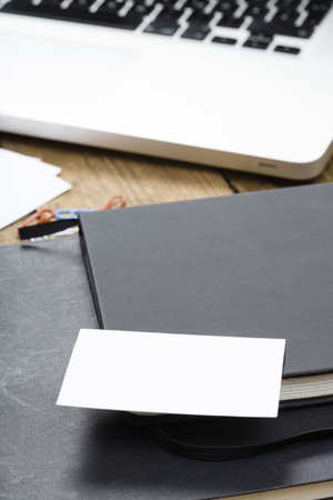 Desktop in office with laptop, tablet computer and phone.の写真素材