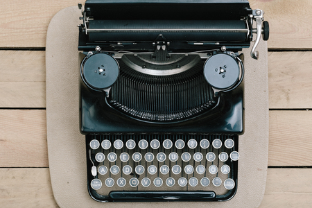 Vintage type writer machine from 1920s on office desk