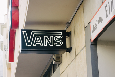 BERLIN, GERMANY - MAY 11, 2017: Vans shoe brand logo on store front at famous Kurfuerstendamm in...