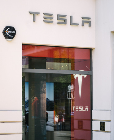 BERLIN, GERMANY - MAY 11, 2017: Tesla electric car company brand logo on store front at famous...