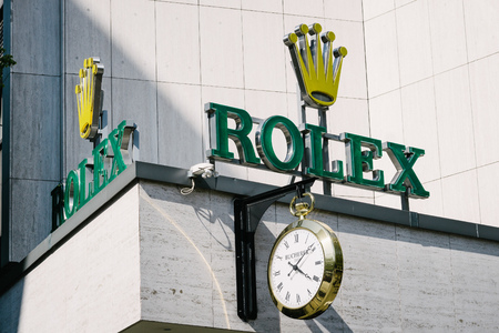 BERLIN, GERMANY - MAY 11, 2017: Rolex trademark brand logo of watch manufacturer on store front at famous Kurfuerstendamm in Berlin Charlottenburg.のeditorial素材