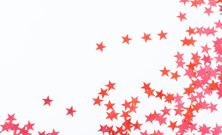 Decorative stars in red color on white background, closeup holiday season detailの写真素材