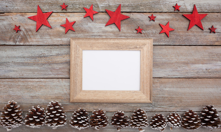Above view on christmas decorated table with empty image frame and copy space for text