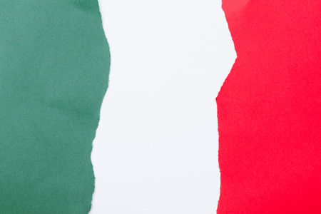 Italian national flag colors green, white and red in ripped layers of paper on cardboardの写真素材