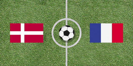 Denmark and France, flags of two countries in international football game pairing on illustrated soccer field with green artificial grass details as sports field texture in backgroundの写真素材