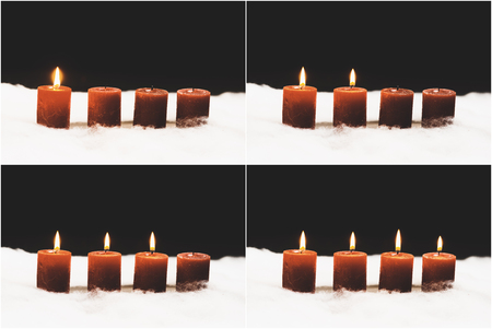Christmas and advent candle still life series in snow with black night background and copy spaceの写真素材