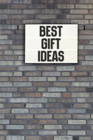 Best Gift Ideas written in light box on brick wall backgroundの写真素材