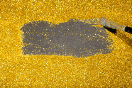 Gold glitter sparkling design background with black center area as copy space, for high value or luxury design imagesの写真素材